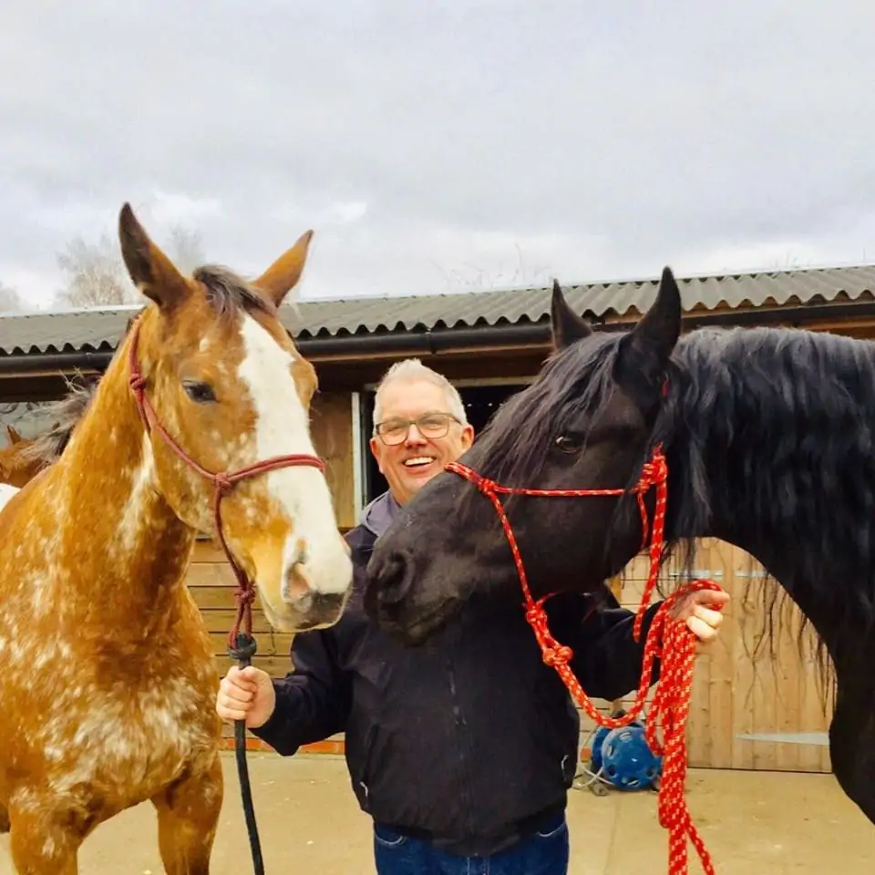 Mike delaney with horses during equine therapy