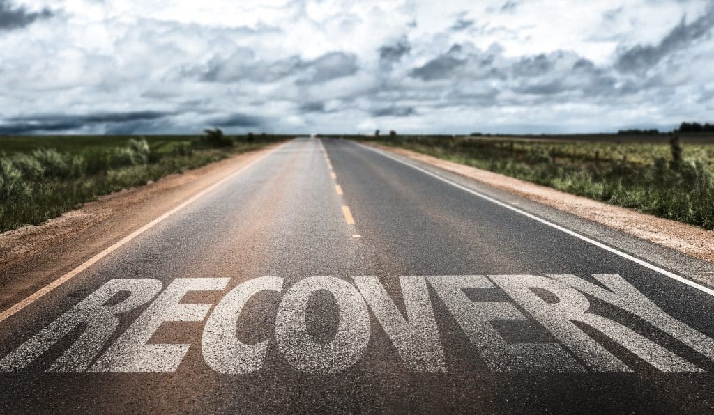 a road with RECOVERY written on it.