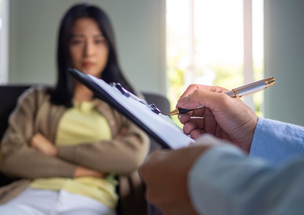 A,Professional,Psychiatrist,Holds,A,Clipboard,To,Note,The,Details